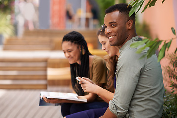 Image showing Young man, friends and smile on campus or college for studying, relaxing and chilling together outside. Diverse people, group and happy with textbook, phone and internet for learning and bonding