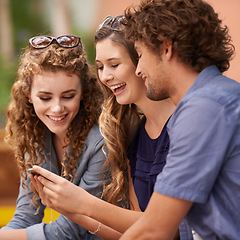 Image showing Friends, laughing and talking with cellphone for social media, internet and text. Young people, conversation and humor with tech for online and scrolling for memes, comedy and laughter with app