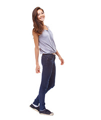 Image showing Portrait, fashion and smile with casual woman in studio isolated on white background for satisfaction. Model, clothes or confident and happy young woman in trendy clothing outfit with denim jeans