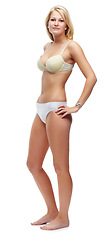 Image showing Beauty, smile and woman with underwear in studio for lingerie, body care and confidence. Happy, attractive and full length portrait of young slim female person with bra isolated by white background.