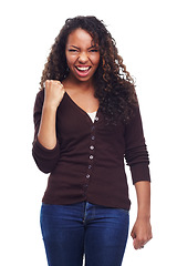 Image showing Portrait, fashion and success with fist of black woman in studio isolated on white background for victory. Achievement, celebration and cheering with confident young person in trendy outfit as winner