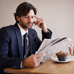 Image showing Businessman, read and newspaper in coffee shop, food and relax on break from work. Male person, crypto investor and finance manager for firm, accounting and analysis stock prices and forex on lunch