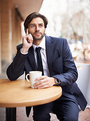 Image showing Outdoor, cafe and businessman thinking with coffee for idea, brainstorming and planning for work. Male person, innovation and tea on table in shop, employee or staff or corporate company for sales