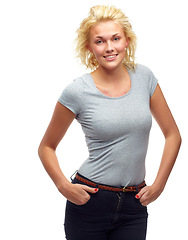 Image showing Portrait, fashion and smile with young model in studio isolated on white background for style. Woman, clothes or outfit and happy person in casual, relaxed or trendy clothing with hands in pockets