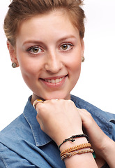 Image showing Model, fashion and jewellery with smile, bracelet and denim with accessories and portrait. Woman, happiness and face for joy, confidence or positivity for style isolated on white background in studio