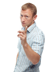 Image showing Man, angry and point in studio portrait with attention, warning or frown for sign by white background. Person, frustrated and hand for icon, symbol or show danger with serious expression for attitude