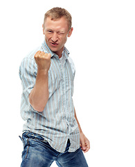 Image showing Man, fist and celebration in studio portrait with success, goals and financial freedom by white background. Person, winner and excited for achievement, prize and competition with cheers for giveaway