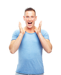 Image showing Portrait, man and shock for surprise, good news and announcement in studio on white background. Excited, happy and male person with smile for hearing, wow, and amazing story, gossip and scoop