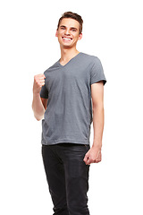 Image showing Portrait, smile and man in celebration for success, winning and goal achievement in studio isolated on a white background. Happy person, cheers and fist pump for victory, promotion or bonus prize