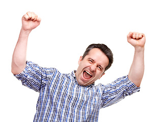 Image showing Man, fist and success with shout in studio for winning, goals or financial freedom by white background. Person, celebration and portrait for achievement, prize or competition with cheers for giveaway