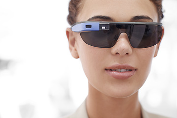 Image showing Closeup, portrait and woman with futuristic sunglasses for fashion, technology or protection from sun. Augmented reality, bokeh and face of female person for smart glasses, innovation and internet.