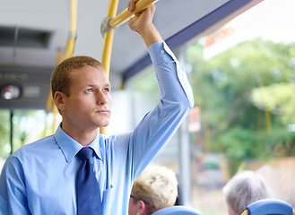 Image showing Thinking, public transport and business man on bus for morning commute to work for start of career or job. Travel, profession and work with young passenger riding metro in city for trip or transit