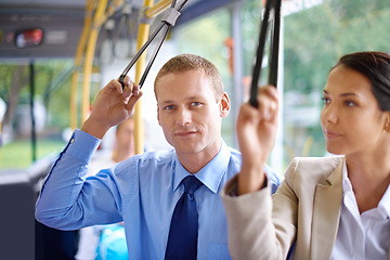 Image showing Portrait, public transport and business man on bus for morning commute to work for start of career or job. Travel, work and young passenger riding metro with colleague in city for trip or transit