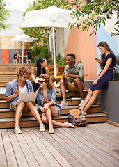 Image showing Students, laptop and discussion of project on break, campus and outdoor for online research on assignment. Friends, diversity or cellphone in college for social media and multimedia for networking