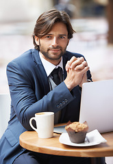 Image showing Businessman, laptop and portrait with cafe, startup and coffee shop with suit and table. Man, broker and news with reading, break and corporate job with mug and restaurant for rest and remote work