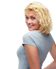 Image showing Portrait, fashion and happy with casual model looking back in studio isolated on white background. Woman, smile or confident with shoulder of young person in relaxed clothing outfit for trendy style