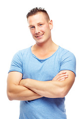 Image showing Smile, portrait and man in studio with arms crossed for confidence, fashion or cool style with t-shirt. Male person, face and pride with happiness for casual, trendy and clothes on white background