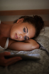 Image showing Woman, tablet and bed at night, scrolling and entertainment with tech and relaxing for peace before sleep. Female person, browsing and online for home, internet and elearning or social media