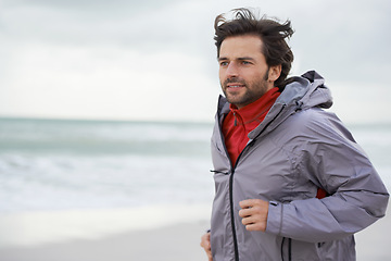 Image showing Beach, man or running for workout, training or wellness outdoor in nature to exercise for body health. Ocean, athlete or person jog for fitness, cardio or sport with energy at sea in winter on mockup