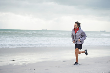 Image showing Beach, man or running for workout, sport or wellness outdoor in nature to exercise for body health. Ocean, athlete or person jog for fitness, cardio or training with energy at sea in winter on mockup