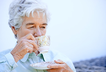 Image showing Senior woman, thinking and relax with coffee or tea and calm for outdoor. Elderly person, holding cup and comfortable in peace retirement, carefree and drink caffeine in nursing home for break