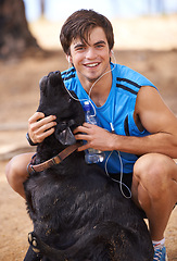 Image showing Smile, man and fitness portrait with dog on hiking trail , walking pet in nature for wellness in health. Listening, music and headphone in relaxing environment or workout, running in cardio exercise