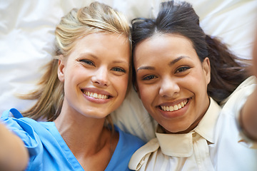 Image showing Smile, portrait and selfie of friends on bed for relax, fun or influencer post on social media. Happy, people and face of women in house for bonding, connection or memory of vacation together