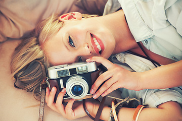 Image showing Portrait, woman and lens for retro, fashion and casual outfit for weekend getaway in Canada. Smile, camera and female person in stylish, trendy and clothing for analog, travel and photography