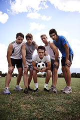 Image showing Soccer player, team and portrait in low angle, field and together with hug for training, exercise and workout. People, sports and football with scrum, embrace and solidarity for game in competition