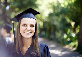 Image showing Graduate, portrait and graduation with woman outdoor at university, college and achievement ceremony. Education, campus and happy at certificate, degree and school event with a smile from diploma