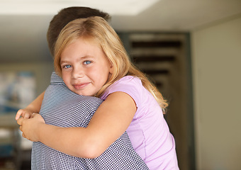 Image showing Family, hug and dad with portrait of girl, relaxing and holding parent for comfort. Smile, happy or fathers day and carrying young child inside home, loving embrace or bonding together in household