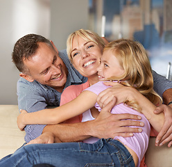 Image showing Happy, child and parents on sofa with love, relax and bonding together in home on weekend. Father, mother and daughter with care in family, playing and excited on vacation with hugging in apartment
