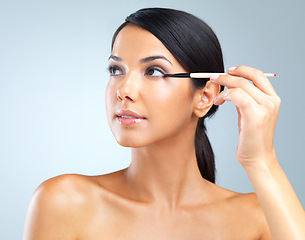 Image showing Woman, eye and brush for beauty, makeup and thinking of cosmetic, idea or vision on white background. Female person, confident or eyeshadow for cosmetology, glow or flawless skin as elegant aesthetic