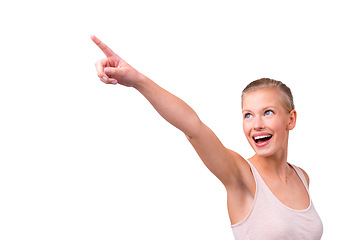 Image showing Woman, pointing and beauty for promotion, marketing and wellness in studio by white background. Happy, female model person and hand gesture for advertisement, show or presentation with mockup space.