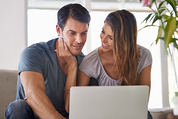 Image showing Couple, home and laptop for entertainment, smile and love for embrace and affection on sofa in lounge. Man, woman and sit with girlfriend, tech and computer in living room to relax and be happy