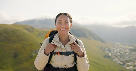 Image showing Happy woman, face and backpack with mountain for hiking, adventure or outdoor journey in nature. Portrait of female person, tourist or hiker smile with bag for trekking or climbing on cliff or hills