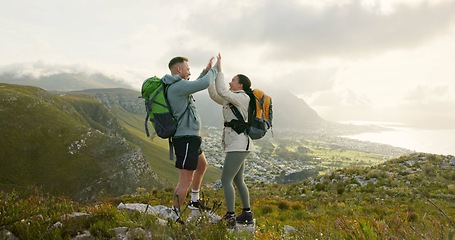 Image showing Couple, high five and hiking on mountains for success, support and travel achievement or goals in nature. Happy people hug with love for outdoor journey and trekking in backpack on eco friendly hills