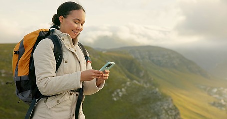 Image showing Woman hiking and travel on mountains with phone for social media update, location search and outdoor internet. Young influencer with backpack and mobile app for trekking results or progress on a hill
