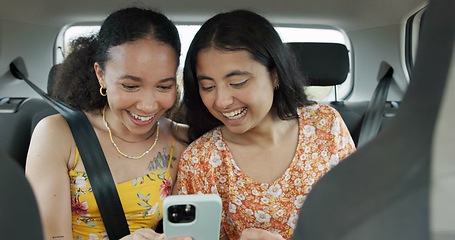 Image showing Woman, friends and phone on road trip with laugh, meme or smile with funny video, adventure or car. Girl, together and reading with blog, journey or holiday with comic video on web in transportation