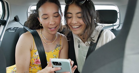 Image showing Happy friends, phone and car for road trip information, location search and social media. Young women reading on mobile app and talking of travel, holiday and transportation service with funny chat