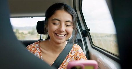 Image showing Woman, phone and road trip in car with laugh, meme and comic video on internet on road for travel. Girl, smartphone and reading in vehicle with funny blog, social media post or story with transport