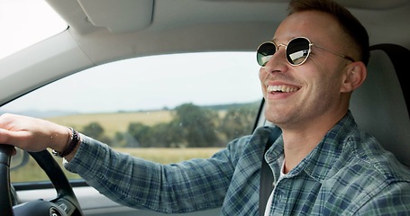 Image showing Happy man, car and driving for road trip, travel or outdoor adventure in the countryside. Young male person or driver smile in vehicle for transportation, journey or vacation on street or asphalt