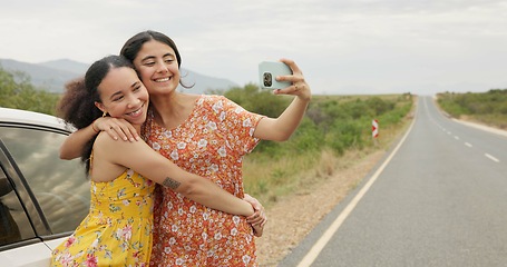 Image showing Women, friends and selfie by car on road trip with memory, profile picture and happy with kiss in countryside. Girl, photography and together with hug, bonding and care for post on social network