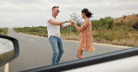 Image showing Nature, dancing and young couple on road trip in countryside listening to music together. Happy, love and man and woman moving to song, playlist or radio by car on vacation, adventure or holiday.