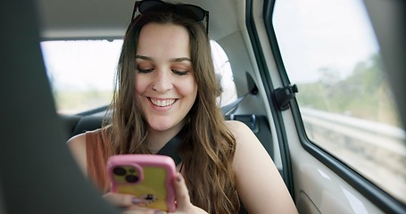 Image showing Happy woman, phone and social media in car for travel, communication or networking in transportation. Female person smile on mobile smartphone in vehicle for online chatting, texting or road trip