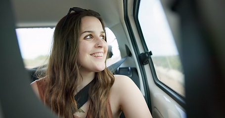 Image showing Thinking, smile and young woman in a car on a road trip for adventure, journey or vacation. Happy, reflection and female person from Australia with memory by window in vehicle for holiday transport.