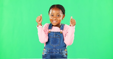 Image showing Child, thumbs up and portrait by green screen with smile for like, thanks or vote for agreement. Girl, African kid and happy with emoji, icon and sign language by chromakey with feedback for decision