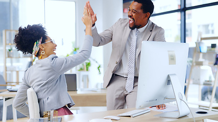 Image showing Happy, business people and high five with computer at office for team success or achievement. Excited man and woman employee or colleagues touching hands for winning, promotion or deal at workplace