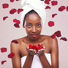 Image showing Portrait, dermatology and black woman with red petals, beauty and treatment on a white studio background. Face, African person and model with natural cosmetics and grooming with skincare and luxury