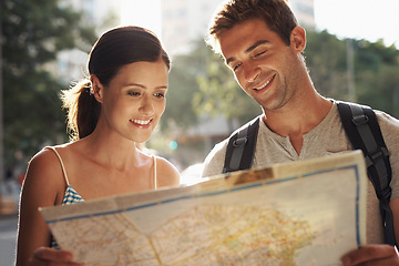 Image showing Happy couple, tourism and city with map for destination, location or tour guide on street or road. Man and woman looking at paper with smile for directions, travel route or outdoor path in urban town